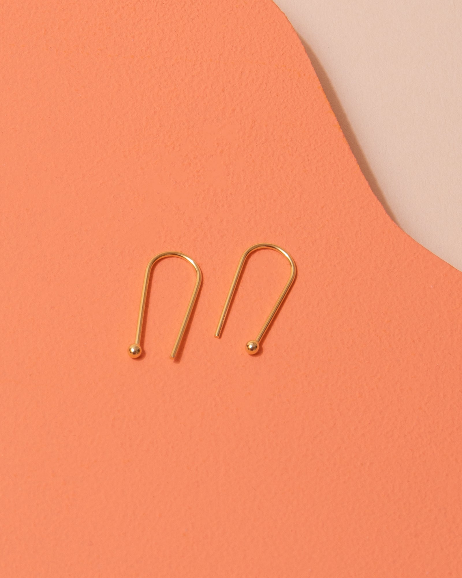 Gold drop earrings by Custom Made