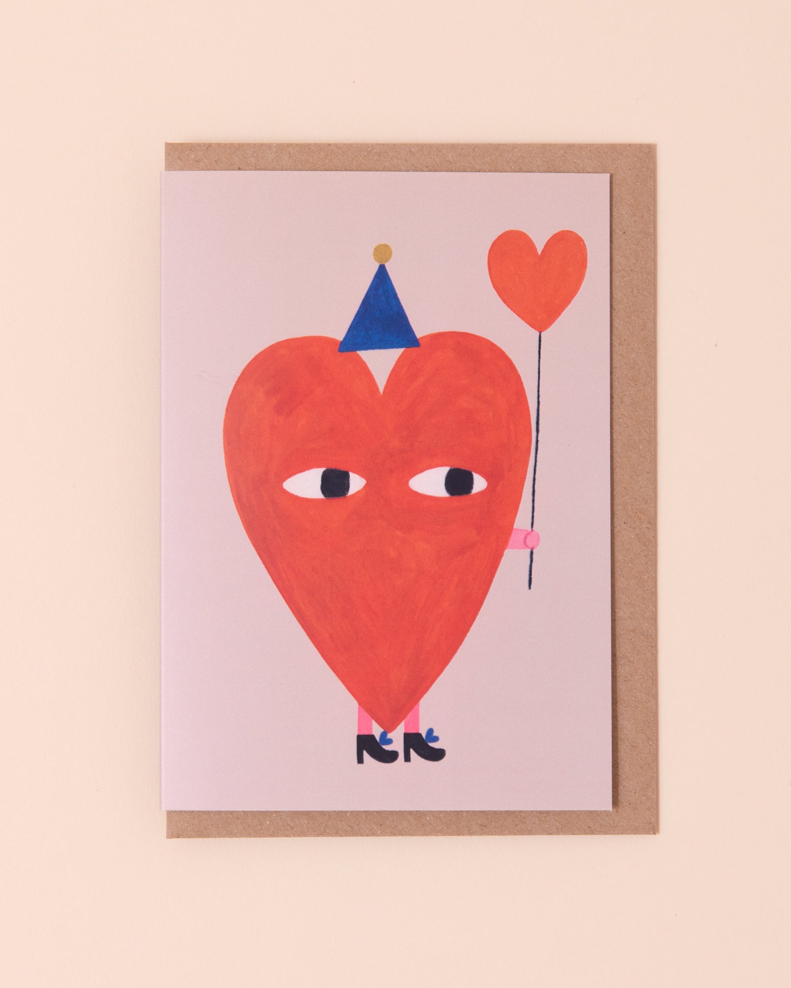 Colourful greetings card with an illustration of a heart holding a balloon