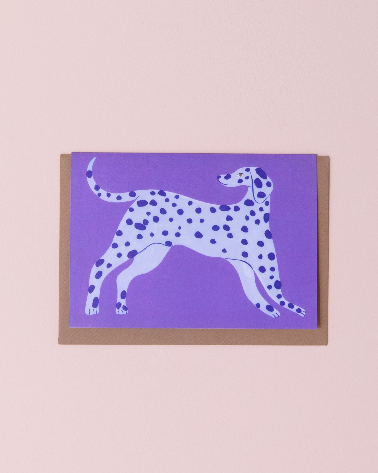 Evermade illustrated greetings card with a brown kraft envelope. Dalmatian dog with blue spots on a purple background.