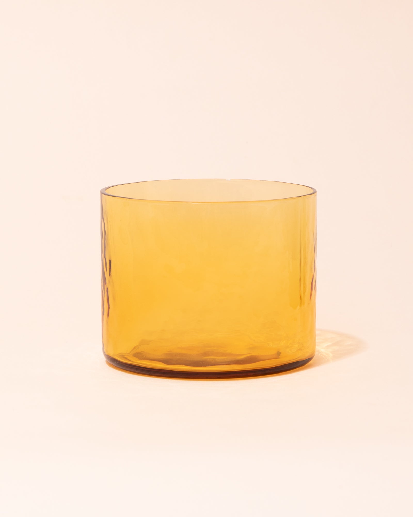 Yellow textured drinking glass by HKLIVING
