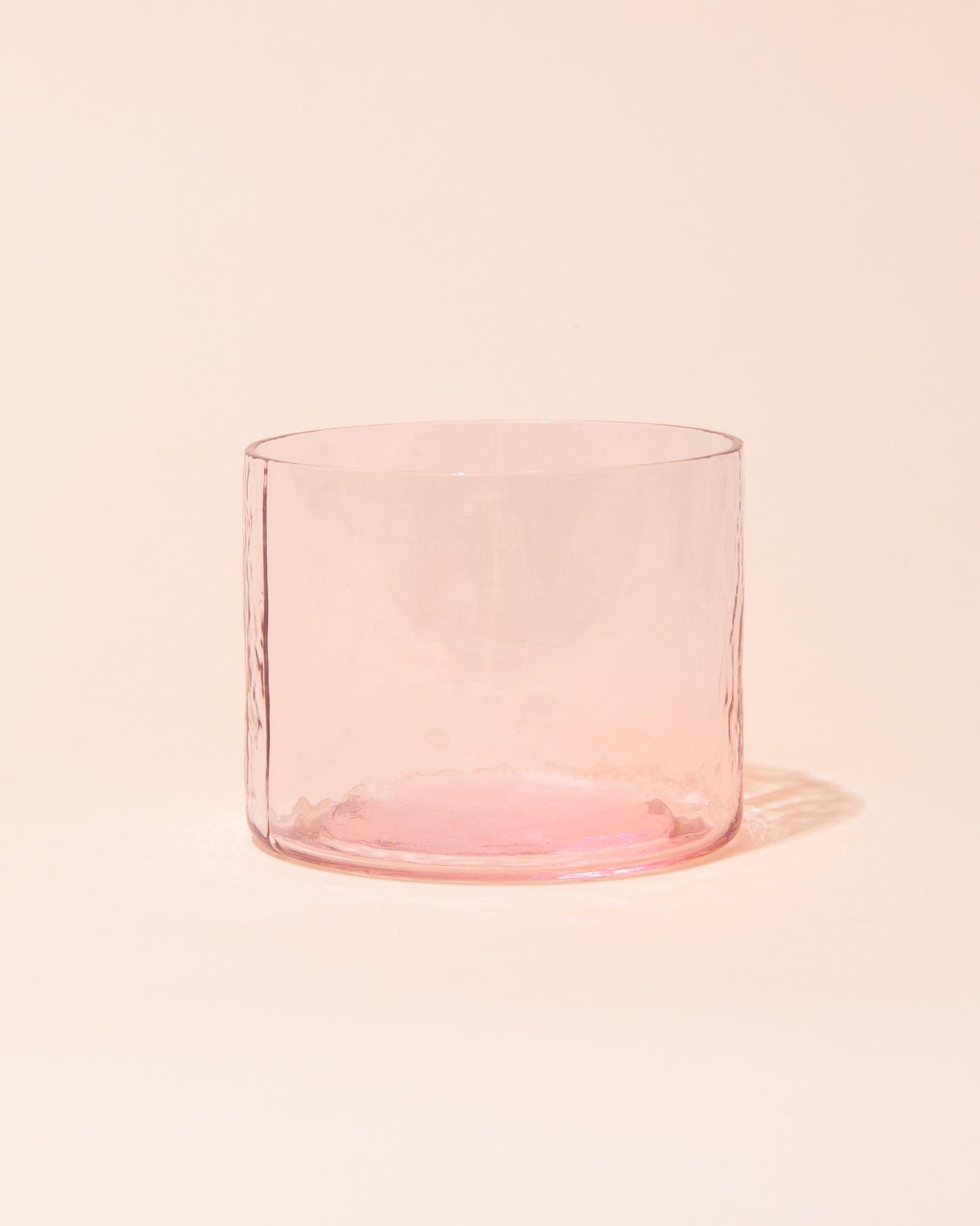 Pink textured drinking glass by HKLIVING