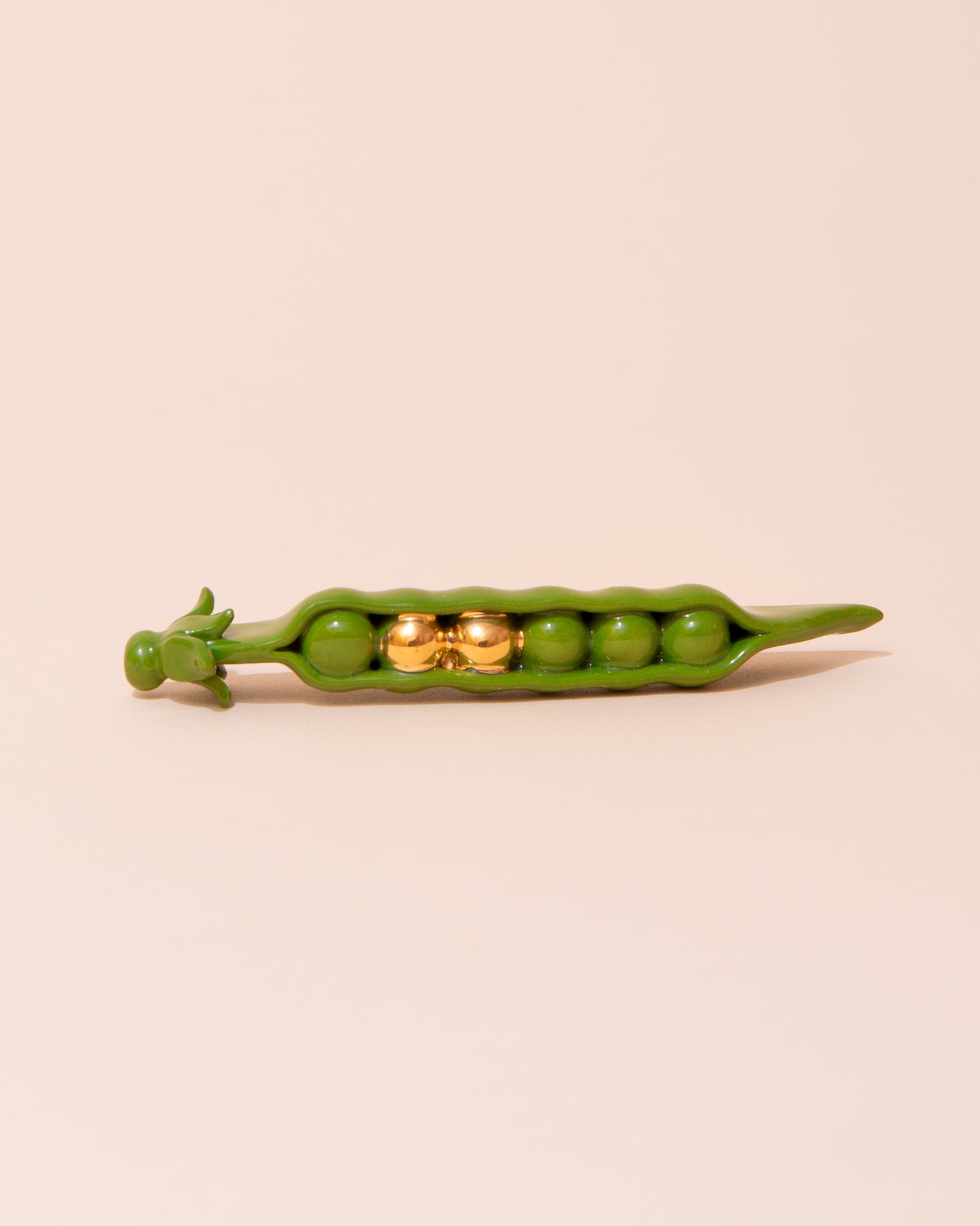 Green and gold ceramic pea pod decoration