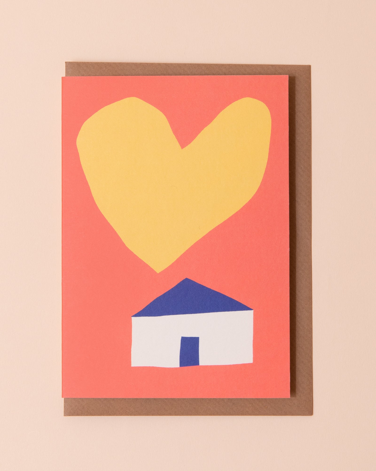 Colourful new home greetings card with an illustration of a house with a yellow heart