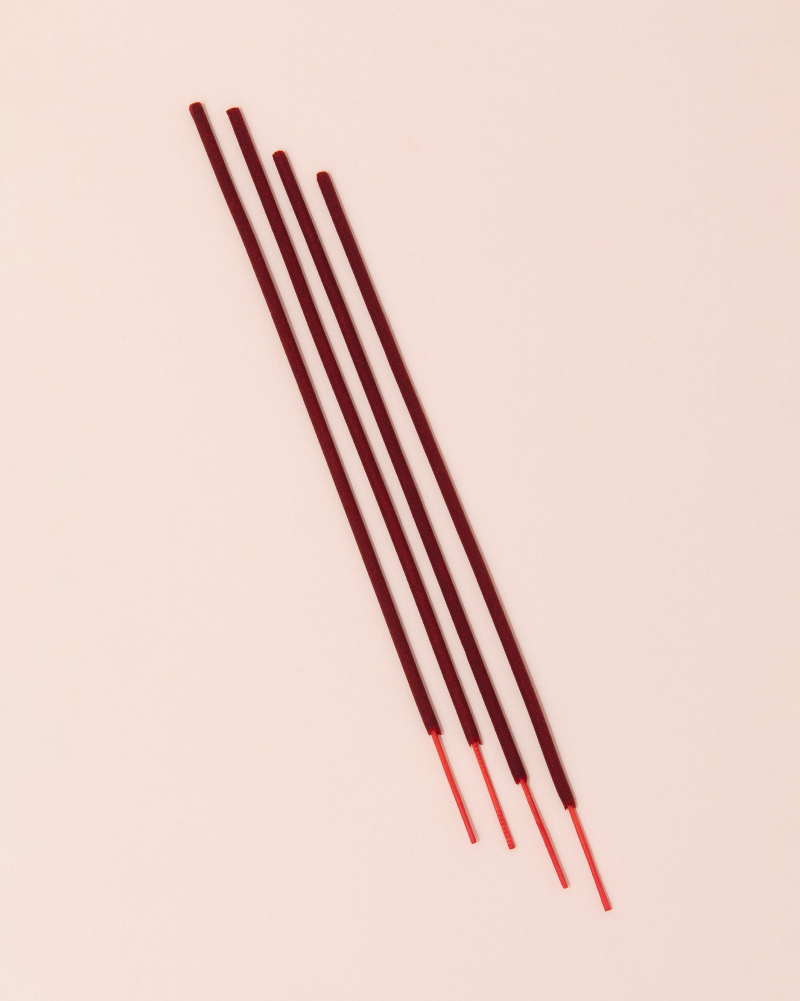 red incense sticks by P.F Candle
