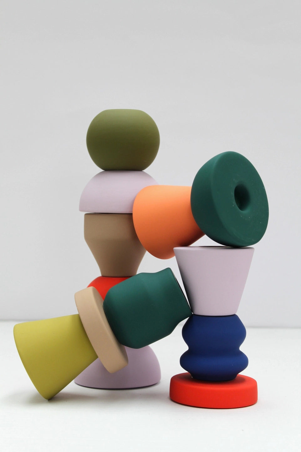 Colourful geometric candle holders and incense holders