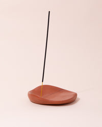 Amanita Labs wavy organic shaped incense holder in terracotta shade