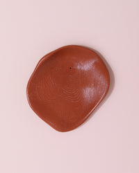 Amanita Labs wavy organic shaped incense holder in terracotta shade