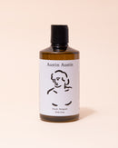 Austin Austin organic neroli and petitgrain body soap in black, white and amber bottle