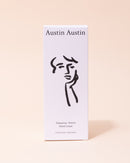 Austin Austin organic palmarosa and vetiver hand cream in black and white box