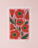 Art print of red poppies. Red and green poppies on a pink background