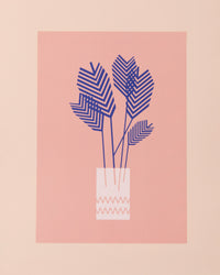 Colourful art print of a blue palm plant on a pink background