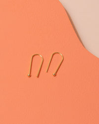 Gold drop earrings by Custom Made
