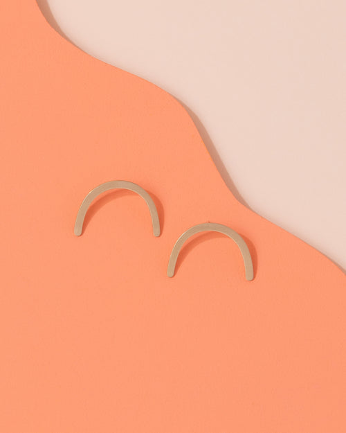 Brass arc earrings by Custom Made