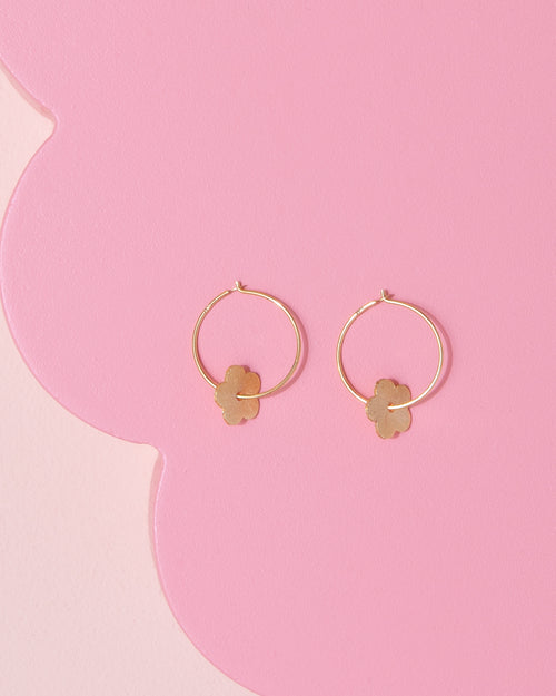 Custom Made gold coloured brass hoop earrings with a flower charm