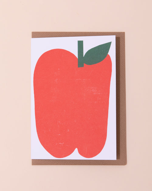 Colourful greetings card with an illustration of a red apple