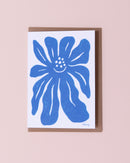 Evermade illustrated greetings card with a brown kraft envelope. Blue flower on a white background.