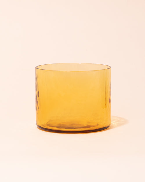 Yellow textured drinking glass by HKLIVING
