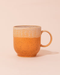 White and yellow ceramic coffee mug by HKLIVING