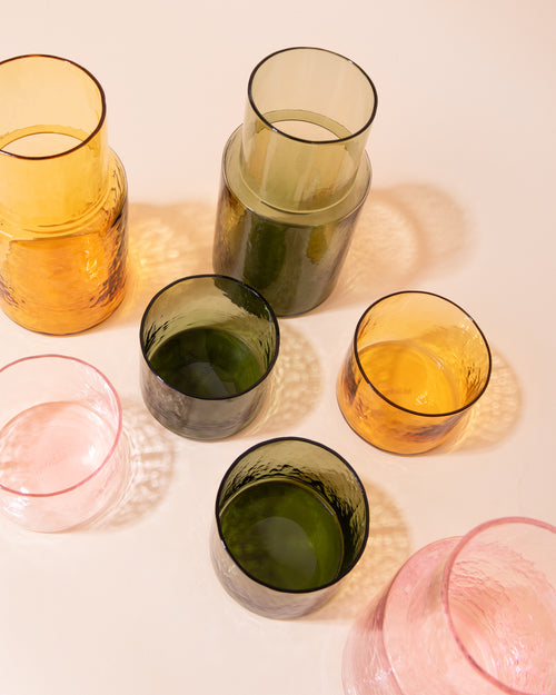 Colourful textured drinking glasses and carafes by HKLIVING