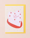 Colourful greetings card with a cake frosted with 'Just Married'