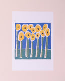 A yellow, green and blue A3 print of flowers in a field