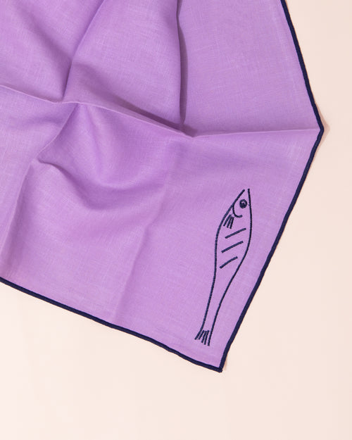 Purple linen napkins with embroidered fish design