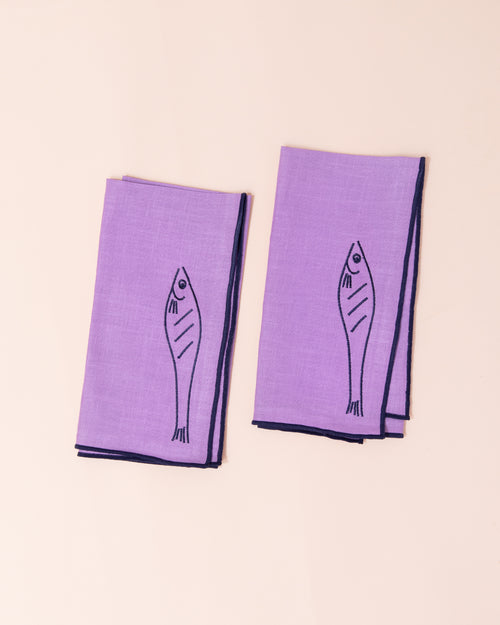 Purple linen napkins with embroidered fish design