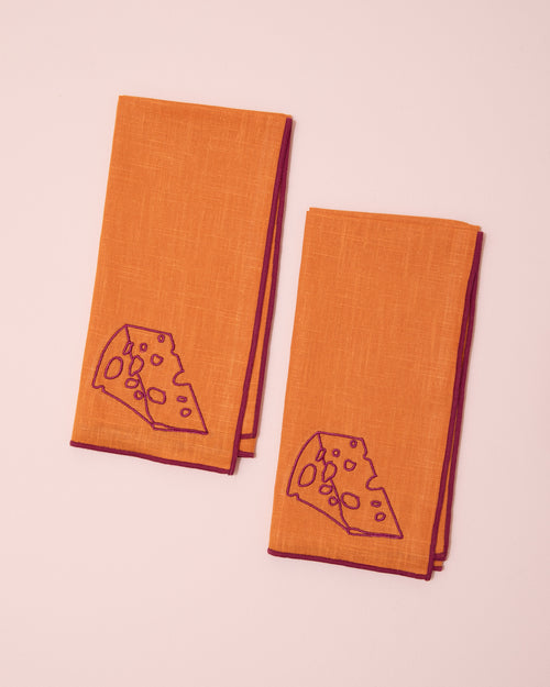 Orange and burgundy embroidered linen napkins with cheese design
