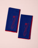 Red and blue embroidered linen napkins with cutlery design