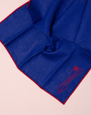 Red and blue embroidered linen napkins with cutlery design