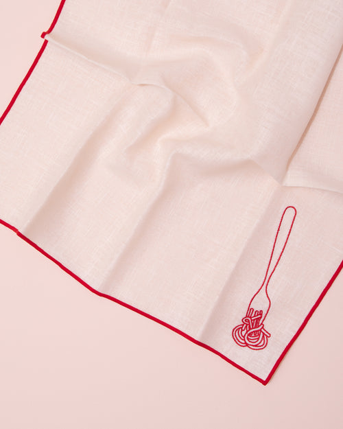 White and red linen napkins with embroidered fork and spaghetti design