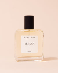 Glass perfume bottle of Maya Njie Tobak fragrance