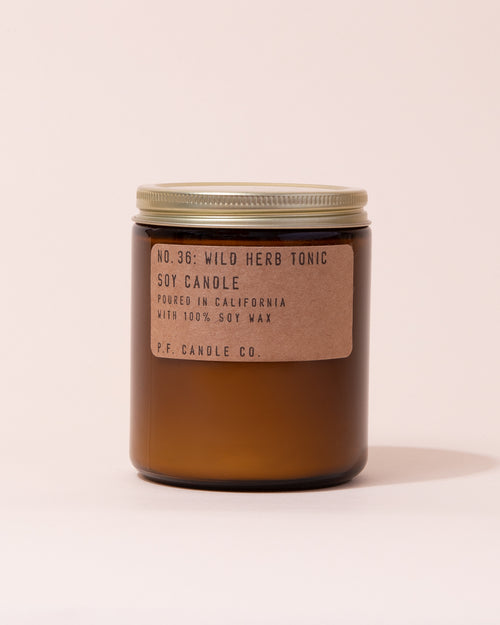 Wild Herb Tonic P.F Candle Co. soy candle in an amber glass jar