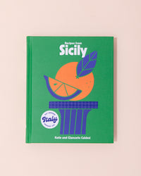 Recipes from Sicily cook book with green, orange and blue cover. 
