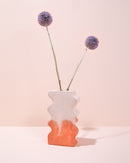 Peach terracotta and white concrete wavy wiggle vase with dried flowers