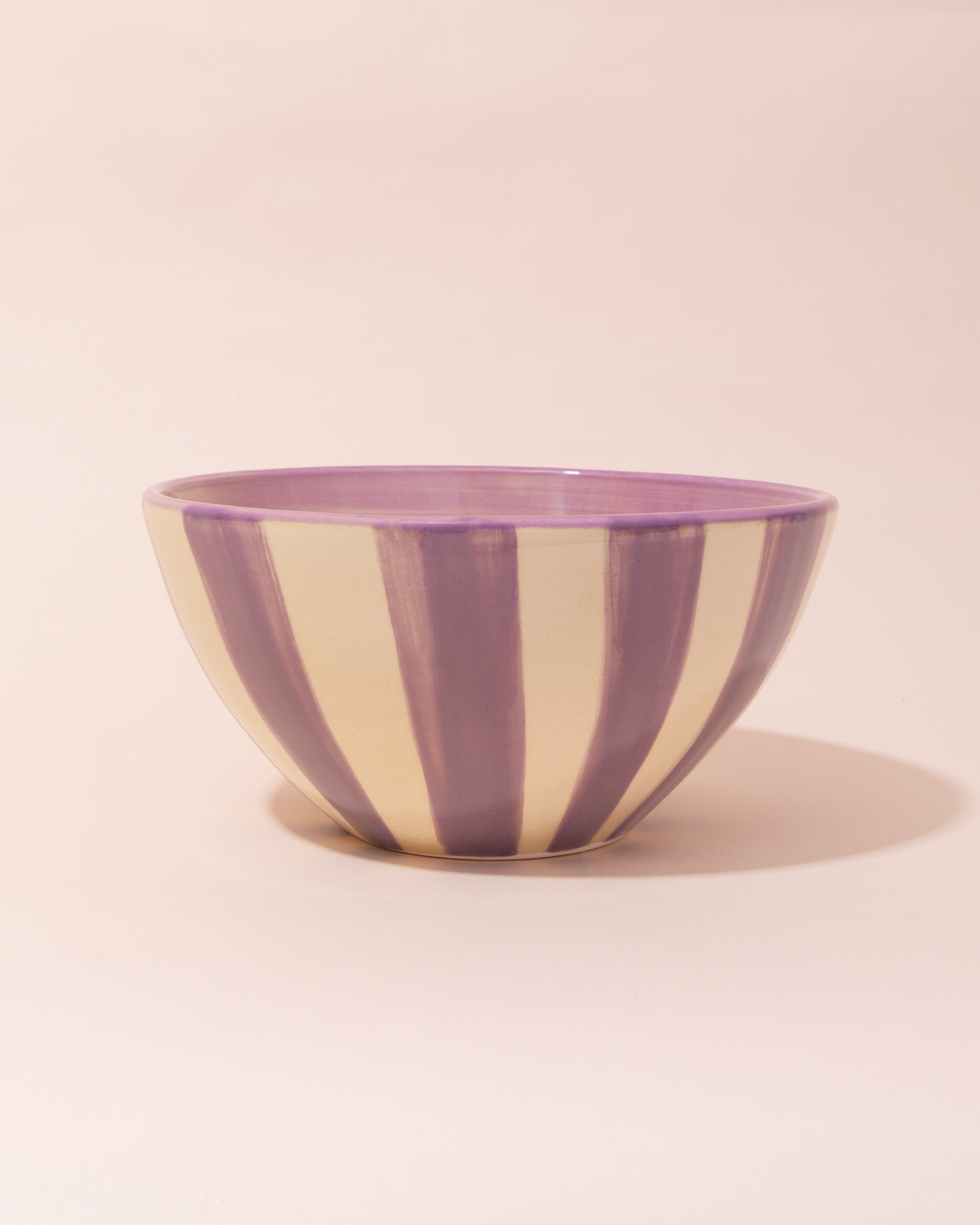 Ceramic salad bowl with purple and cream stripes