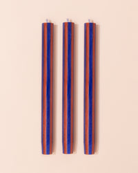 Maroon and red stripe dinner candle
